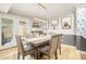 Elegant dining room with modern lighting and stylish decor at 114 Emily Ln, Alpharetta, GA 30009
