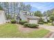 Charming two-story home with a well-manicured lawn, lush landscaping, and an attached two car garage at 114 Emily Ln, Alpharetta, GA 30009