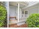 Inviting front porch with a bench seat and white railing with view of the front door at 114 Emily Ln, Alpharetta, GA 30009