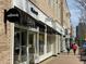 Street view of Allbirds and Madewell retail stores with awnings and glass fronts on a sunny day at 114 Emily Ln, Alpharetta, GA 30009
