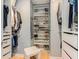 Well-organized walk-in closet with custom shelving and ample storage space for shoes and clothes at 114 Emily Ln, Alpharetta, GA 30009