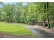 Picturesque walking trail through a lush green park with a bridge at 114 Emily Ln, Alpharetta, GA 30009