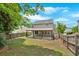 Backyard with a covered patio, a grassy lawn, and a wood perimeter fence at 207 Diamond Valley Pass, Canton, GA 30114