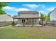 Backyard with a covered patio area, fenced perimeter, and a grassy lawn at 207 Diamond Valley Pass, Canton, GA 30114