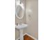 Clean half-bath with pedestal sink, white trim, and updated fixtures for guests at 207 Diamond Valley Pass, Canton, GA 30114