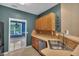 View of kitchen with stainless steel appliances, light wood cabinets, and breakfast bar at 207 Diamond Valley Pass, Canton, GA 30114
