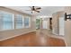 Bright living room with hardwood floors, backyard access, and lots of natural light from the windows at 207 Diamond Valley Pass, Canton, GA 30114
