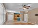 Open living area with ceiling fan, hardwood floors, and seamless flow into the kitchen space at 207 Diamond Valley Pass, Canton, GA 30114