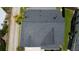 Overhead shot of dark-shingled roof with vents, gutters and a driveway visible below at 207 Diamond Valley Pass, Canton, GA 30114