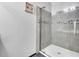The modern shower features a glass door and stylish tile creating a spa-like experience at 207 Diamond Valley Pass, Canton, GA 30114