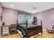 Well lit bedroom with hardwood floors, complemented by natural light and an area rug at 3025 Mountain Creek Ne Ct, Roswell, GA 30075