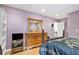 Well lit bedroom with hardwood floors, complemented by natural light, wood furniture, and neutral walls at 3025 Mountain Creek Ne Ct, Roswell, GA 30075