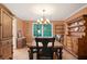 Inviting dining room with wood table and natural light from a large window at 3025 Mountain Creek Ne Ct, Roswell, GA 30075