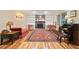 Cozy living room with hardwood floors, brick fireplace, and built-in bookshelves for a relaxed atmosphere at 3025 Mountain Creek Ne Ct, Roswell, GA 30075