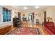 Bright living room featuring hardwood floors, large windows, and a comfortable seating area with stylish decor at 3025 Mountain Creek Ne Ct, Roswell, GA 30075