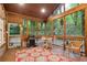 Relaxing screened-in porch with wooden ceiling and beams, decorative rug, and backyard views. Enjoy outdoor living! at 3025 Mountain Creek Ne Ct, Roswell, GA 30075