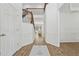 Bright open foyer with wood floors, staircase and white wainscoting welcomes you into the home at 303 Ridgewood Trl, Canton, GA 30115