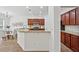 Open kitchen features granite countertops, stainless appliances, and a breakfast nook at 303 Ridgewood Trl, Canton, GA 30115