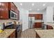 Well-equipped kitchen with granite countertops, stainless steel appliances, and ample cabinet space at 303 Ridgewood Trl, Canton, GA 30115