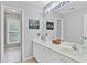 Bathroom featuring double sinks, large mirrors, and plenty of natural light at 3990 Madison Main Nw, Kennesaw, GA 30144