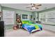 Cozy bedroom featuring comfortable bed, natural light, and colorful decor at 3990 Madison Main Nw, Kennesaw, GA 30144