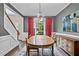 Formal dining room with a modern chandelier, hardwood floors, and large windows at 3990 Madison Main Nw, Kennesaw, GA 30144