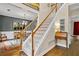 Open foyer showcasing staircase, hard wood flooring, and a dining room at 3990 Madison Main Nw, Kennesaw, GA 30144