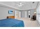 Open main bedroom showing ensuite bathroom, television, and large windows at 3990 Madison Main Nw, Kennesaw, GA 30144