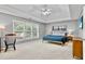 Spacious main bedroom features large window, tray ceiling with fan, and ensuite bathroom at 3990 Madison Main Nw, Kennesaw, GA 30144