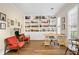 Inviting home office featuring built-in bookshelves, hardwood flooring, and lots of natural light at 3990 Madison Main Nw, Kennesaw, GA 30144