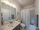 Clean bathroom featuring a vanity, toilet, shower and bathtub at 7345 Vale Ct, Cumming, GA 30028