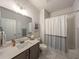 Clean bathroom featuring a vanity, toilet, shower and bathtub at 7345 Vale Ct, Cumming, GA 30028