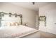 Charming bedroom featuring floral accents and a comfortable bed, creating a cozy and inviting atmosphere at 7345 Vale Ct, Cumming, GA 30028