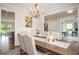 Traditional dining room featuring a wooden table and decorative chandelier with elegant decor and lots of natural light at 7345 Vale Ct, Cumming, GA 30028