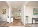 Inviting foyer showcasing hardwood floors and open access to the living and dining areas at 7345 Vale Ct, Cumming, GA 30028