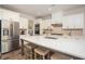 Kitchen featuring a large island, white cabinets, stainless steel appliances, and modern finishes with ample counter space at 7345 Vale Ct, Cumming, GA 30028