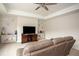 Spacious living room with an entertainment center, overhead lighting and comfortable seating at 7345 Vale Ct, Cumming, GA 30028