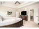 Comfortable main bedroom with neutral tones, large window, and access to a private bath at 7345 Vale Ct, Cumming, GA 30028