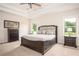 Spacious bedroom with large windows and stylish furnishings, providing a serene retreat at 7345 Vale Ct, Cumming, GA 30028
