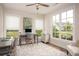 Bright home office featuring large windows, neutral walls, and comfortable seating at 7345 Vale Ct, Cumming, GA 30028
