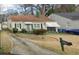 Traditional home with a cozy front porch, quaint green accents, and a neatly kept yard with a mailbox at 1785 S Olympian Sw Way, Atlanta, GA 30310