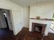 Vintage living room featuring a brick fireplace and hardwood floors at 1785 S Olympian Sw Way, Atlanta, GA 30310