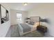 Neutral bedroom featuring stylish decor, including gray accents, soft light from windows, and modern furniture at 333 Torcello Blvd, Mcdonough, GA 30253