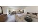 Bright open-concept living and dining area with modern furniture and a view of the kitchen at 333 Torcello Blvd, Mcdonough, GA 30253