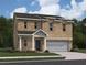 Charming two-story brick home with attached garage and well-maintained landscaping at 412 Corricella Ct, Mcdonough, GA 30253