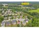 A top-down shot highlights the house's location near a highly-rated school and pond at 648 York View Dr, Auburn, GA 30011
