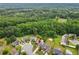 A bird's eye view of a house with a pool, nestled within a lush, green neighborhood at 648 York View Dr, Auburn, GA 30011