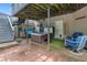 Cozy back patio with a hot tub and a sitting area, perfect for relaxation and entertaining at 648 York View Dr, Auburn, GA 30011