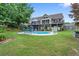 Beautiful backyard featuring a well-maintained lawn, landscaped garden and a private pool at 648 York View Dr, Auburn, GA 30011