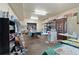 Spacious basement area with paint supplies, worktables, display shelves and bright lighting at 648 York View Dr, Auburn, GA 30011
